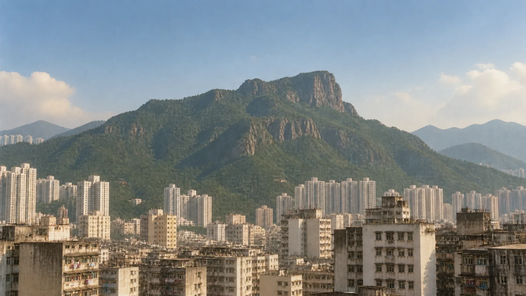 Old Kowloon beneath Lion Rock in hazy daylight